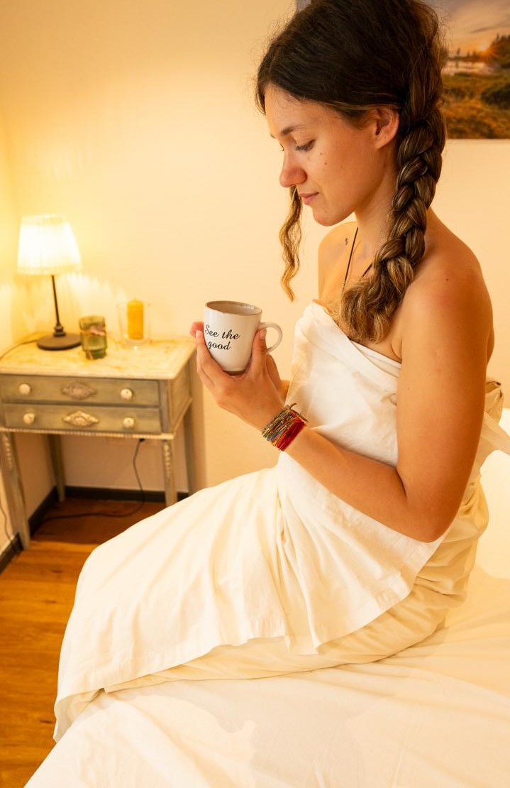 Viktoria enjoying a cup of tea after a massage