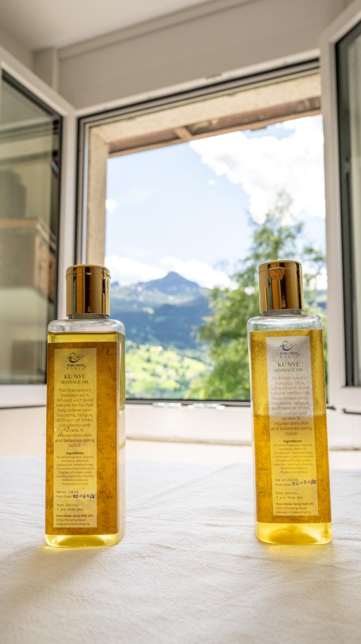 Kunye massage oils in front of the Grindelwald mountains